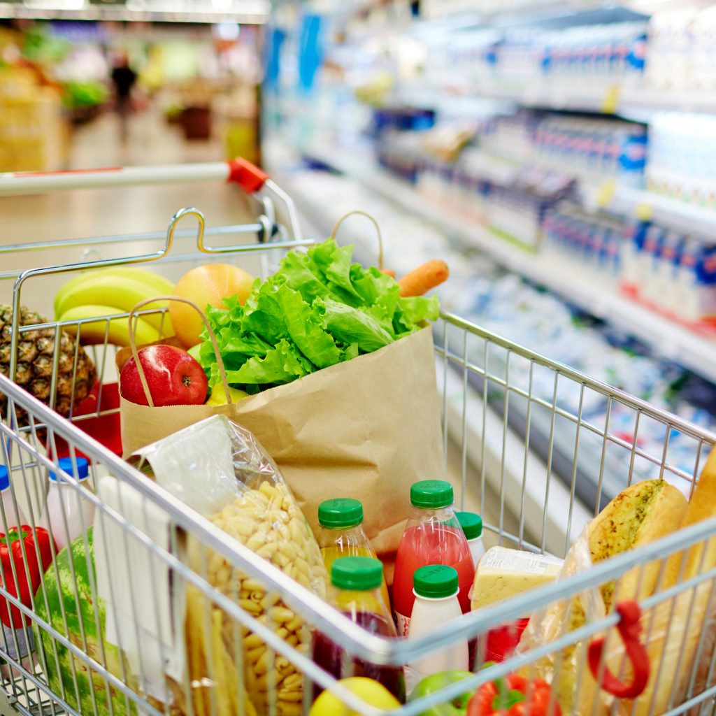 Different kinds of fresh food products in cart